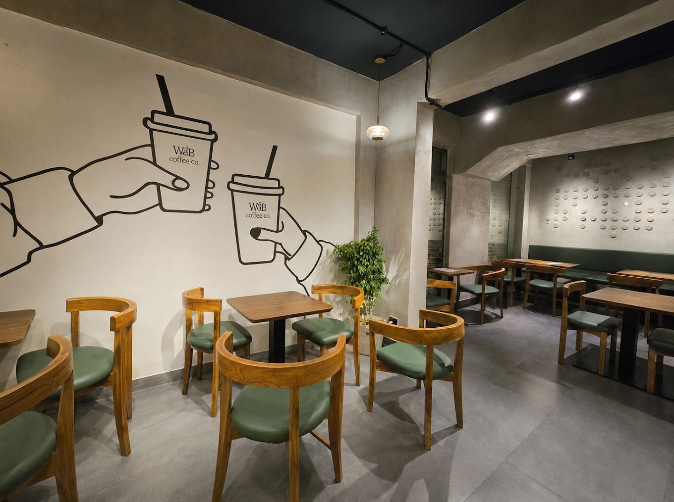 WÁB café seating and mural